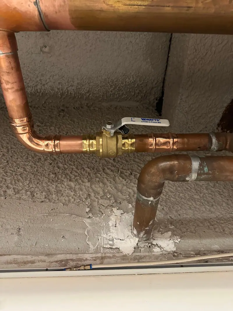 Copper supply line with a brass shut-off valve, a repipe detail from an Authentic Plumbing job