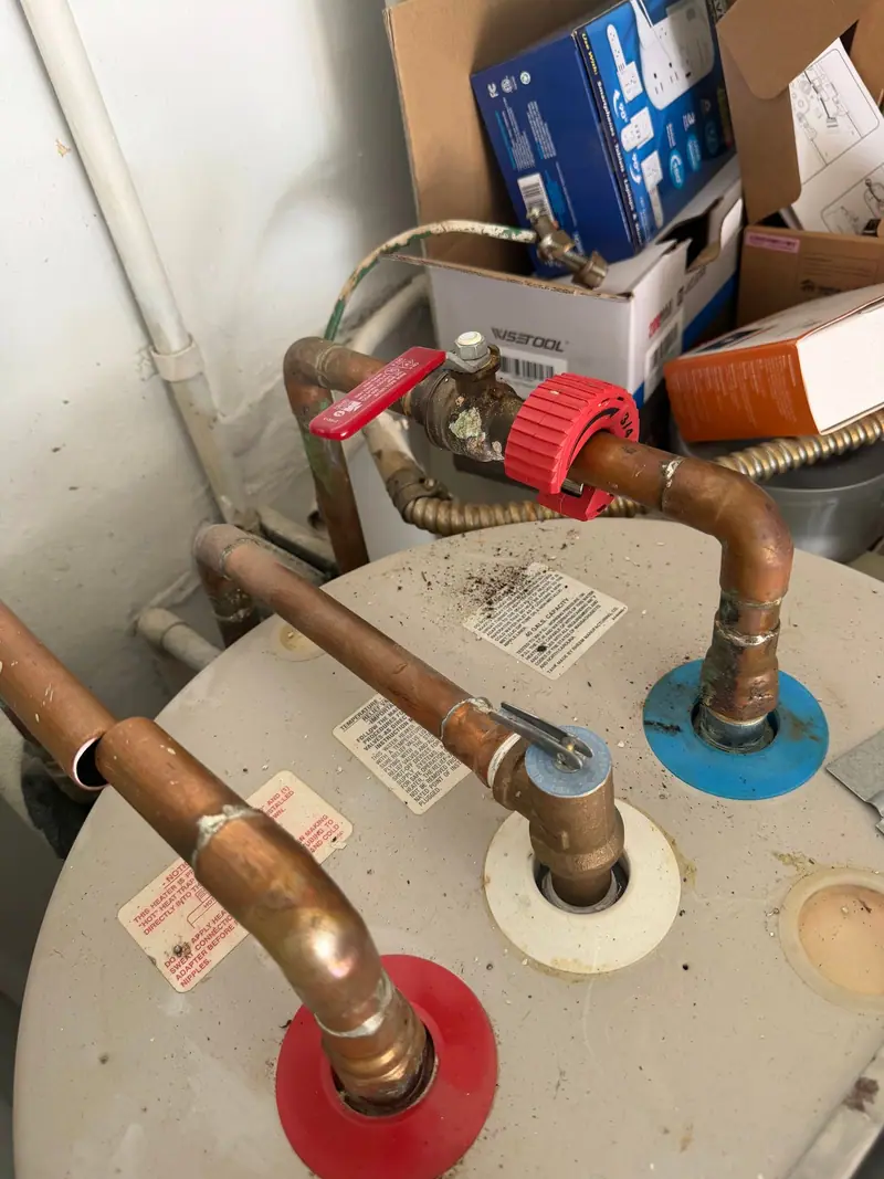 Copper connections on top of an electric tank water heater